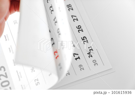 flipping through the pages of the flip calendar. flipping through the pages of the flip calendar. 101615936