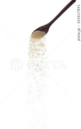 Brown Sugar fall, brown grain sugar pouring down abstract cloud fly from wooden spoon. Beautiful complete seed sugarcane, food object design. Selective focus freeze shot white background isolated Brown Sugar fall, brown grain sugar pouring down abstract cloud fly from wooden spoon. Beautiful complete seed sugarcane, food object design. Selective focus freeze shot white background isolated 101617841