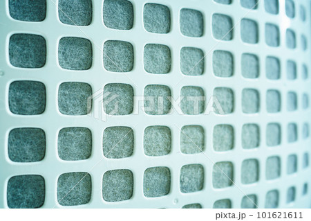 Dirty - dusty air purifier filter in living room. Air purifier machine lid or grille filter fully with a dust and polluted particle. 101621611