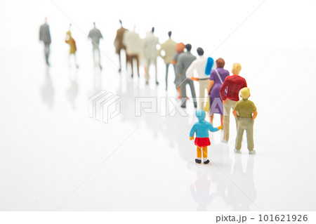 miniature people. little girl stands against the background of other people miniature people. little girl stands against the background of other people 101621926