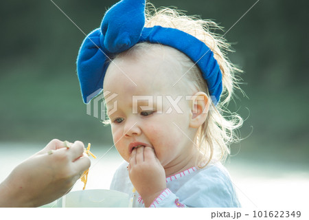 cute baby gilr is eating thai food outdoor 101622349