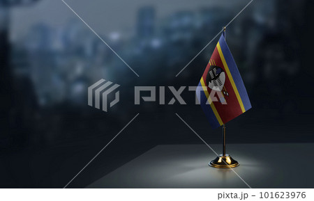 Small flags of the Swaziland on an abstract blurry background Small flags of the Swaziland on an abstract blurry background 101623976