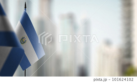 Small flags of the Salvador on an abstract blurry background Small flags of the Salvador on an abstract blurry background 101624102