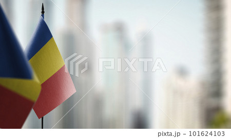 Small flags of the Romania on an abstract blurry background Small flags of the Romania on an abstract blurry background 101624103