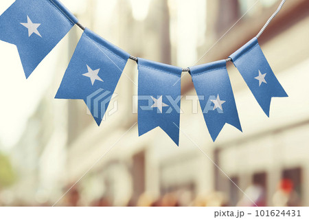 A garland of Somalia national flags on an abstract blurred background 101624431