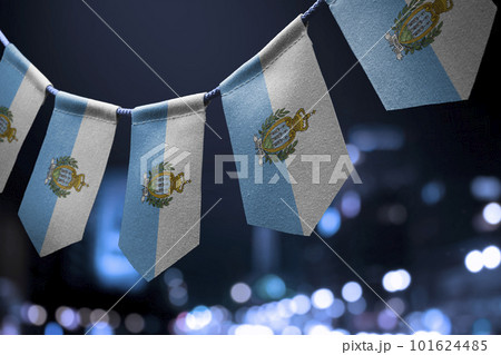 A garland of San Marino national flags on an abstract blurred background A garland of San Marino national flags on an abstract blurred background 101624485
