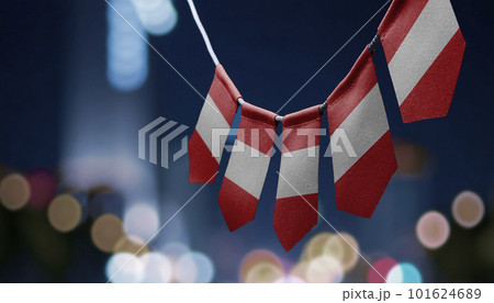 A garland of Peru national flags on an abstract blurred background 101624689