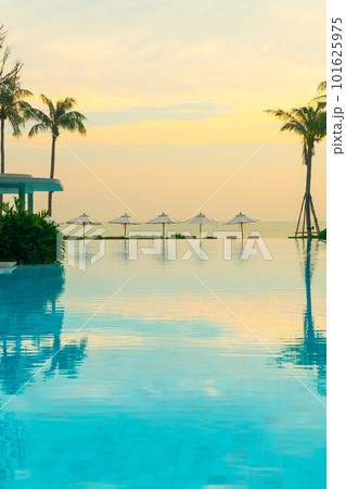 umbrella with bed pool around swimming pool with ocean sea background umbrella with bed pool around swimming pool with ocean sea background 101625975