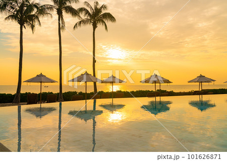 umbrella with bed pool around swimming pool with ocean sea background 101626871