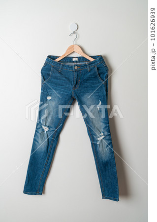 jeans trousers hanging on wall 101626939