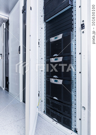 Data center with a row of server racks Data center with a row of server racks 101630100