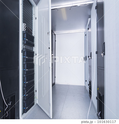 Data center with a row of server racks 101630117