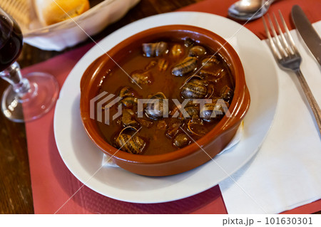 Mediterranean seafood stew of caracoles snails with vegetable sauce 101630301
