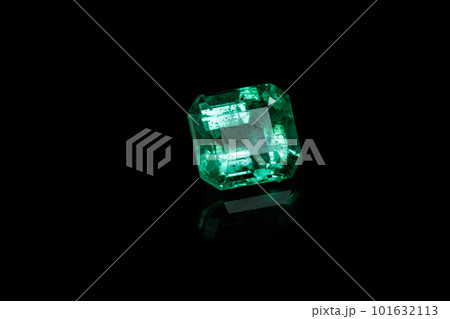 Macro mineral Emerald gemstone faceted on black background 101632113