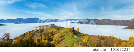 Morning foggy clouds in autumn mountain countryside.  Ukraine, Carpathian Mountains, Transcarpathia. Peaceful picturesque traveling, seasonal, nature and countryside beauty concept scene. 101632234