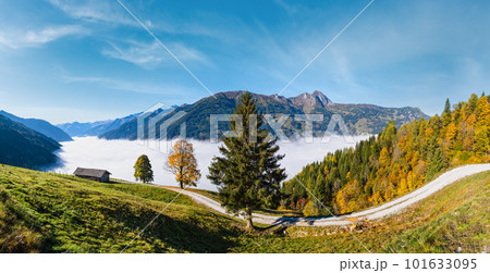 Peaceful misty autumn morning mountain view from hiking path from Dorfgastein to Paarseen lakes, Land Salzburg, Austria. 101633095