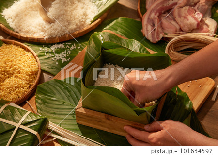 Vietnamese traditional Chung cake with dong leaves, pork glutinous rice for holiday food advertising. Traditional lunar new year food 101634597