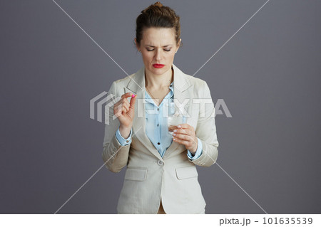 stressed 40 years old woman employee in light business suit 101635539