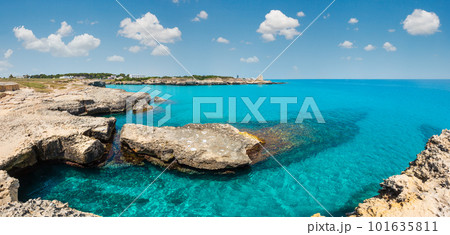 Picturesque seascape with white rocky cliffs, caves, sea bay and islets at Grotta della poesia, Roca Vecchia, Salento Adriatic sea coast, Puglia, Italy Picturesque seascape with white rocky cliffs, caves, sea bay and islets at Grotta della poesia, Roca Vecchia, Salento Adriatic sea coast, Puglia, Italy 101635811