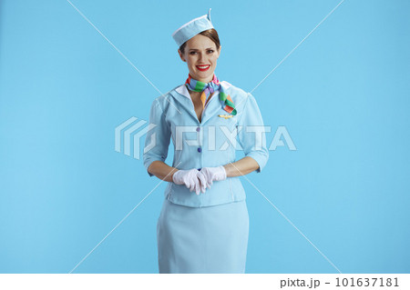 happy modern female stewardess on blue 101637181