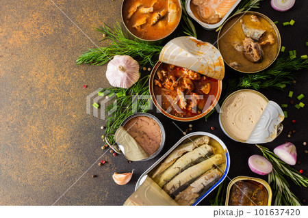 Open tin cans with canned fish Open tin cans with canned fish 101637420