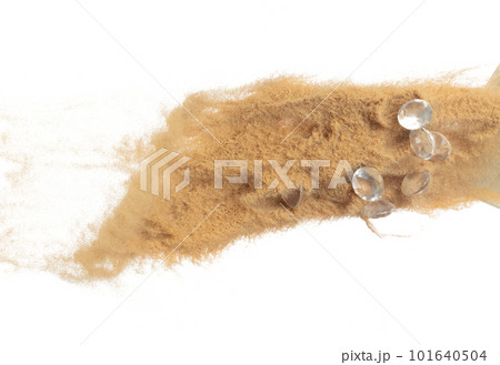 Diamond crystal fly splashing in mid air. Diamond precious stone explosion flying with sand powder dust under dry sun. White background isolated high speed shutter freeze motion 101640504