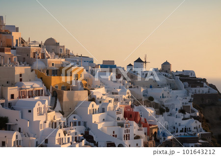 A view of a hillside with white buildings on it. AI generative image 101643212
