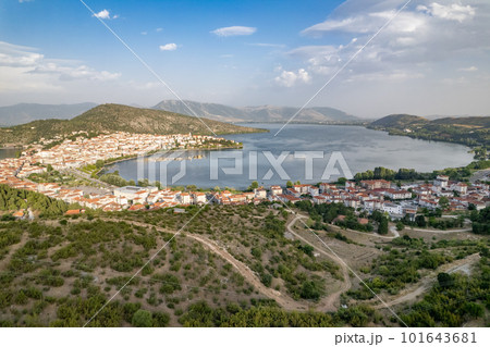 Landscape of countryside town, village and lake of Orestiada in Kastoria during summer sunny day over a mountain peak in Greece. Aerial, drone, top view. Panorama 101643681