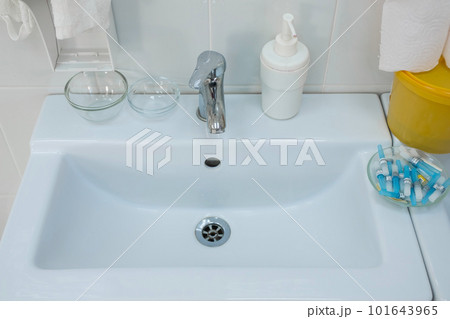 White sink in hospital room with liquid soap and medical things. 101643965