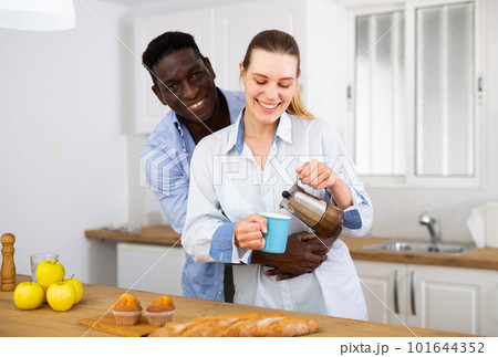 Husband and wife having breakfast together at home Husband and wife having breakfast together at home 101644352