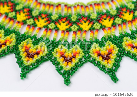 handmade colorful bead necklace close-up isolated on white background. handmade colorful bead necklace close-up isolated on white background. 101645626