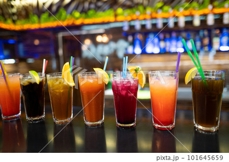 many different cocktails prepared by at the bar 101645659