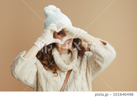 smiling modern 40 years old woman showing heart shaped hands smiling modern 40 years old woman showing heart shaped hands 101646496