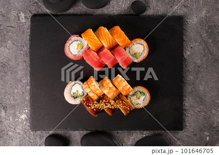 Sushi rolls set on dark background. Japanese and asian food concept top view 101646705