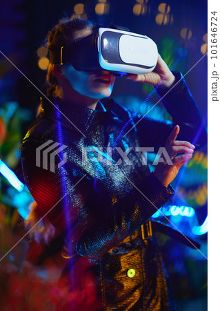 stylish female in metaverse pressing button in air 101646724
