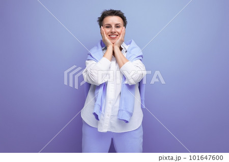 positive young woman with short haircut in stylish casual look positive young woman with short haircut in stylish casual look 101647600