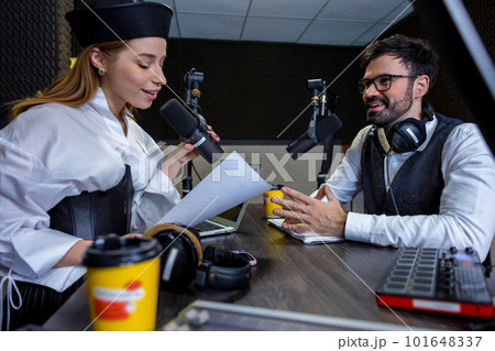 Young girl talking with dark-haired man Young girl talking with dark-haired man 101648337