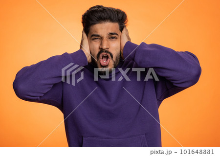 Annoyed irritated handsome man covering ears gesturing No avoiding advice ignoring noise loud voices Annoyed irritated handsome man covering ears gesturing No avoiding advice ignoring noise loud voices 101648881