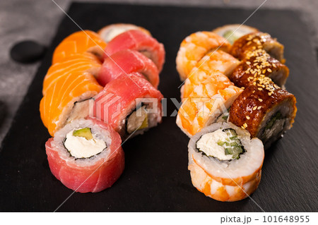 Sushi rolls set on dark background. Japanese and asian food concept Sushi rolls set on dark background. Japanese and asian food concept 101648955