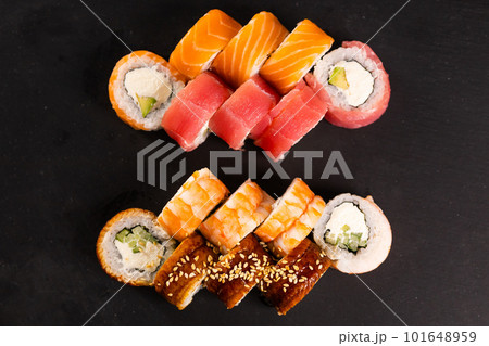Sushi rolls set on dark background. Japanese and asian food concept top view 101648959