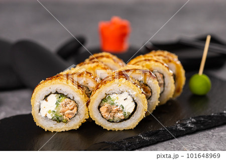 Sushi roll on dark background. Japanese and asian food concept 101648969