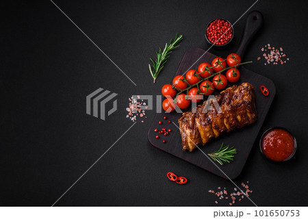 Delicious grilled pork ribs with sauce, spices and herbs 101650753