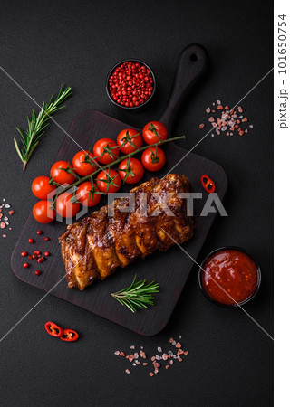 Delicious grilled pork ribs with sauce, spices and herbs Delicious grilled pork ribs with sauce, spices and herbs 101650754