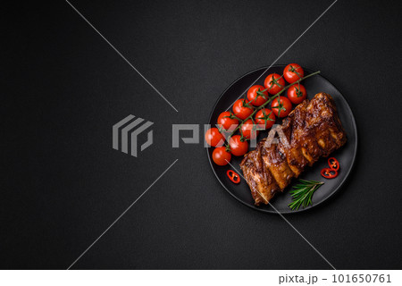Delicious grilled pork ribs with sauce, spices and herbs Delicious grilled pork ribs with sauce, spices and herbs 101650761