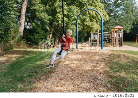 Funny cute happy baby playing on the playground. The emotion of happiness, fun, joy. Smile of a child. boy playing on the playground 101650802