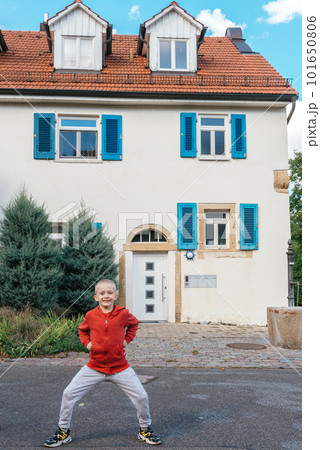 A little wriggles against the backdrop of a beautiful ancient historic building in Germany A little wriggles against the backdrop of a beautiful ancient historic building in Germany 101650806