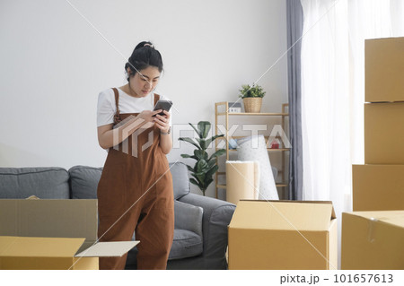 Modern female people in moving home apartment leisure indoor activity alone. Modern female people in moving home apartment leisure indoor activity alone. 101657613