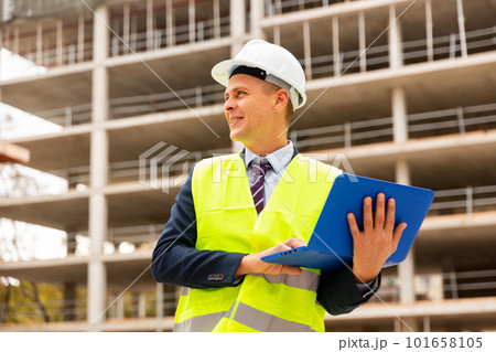 Architect with laptop computer on building site Architect with laptop computer on building site 101658105