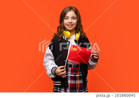 Girl holds small flag China 101660045