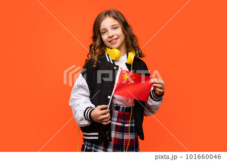 Girl holds small flag China 101660046